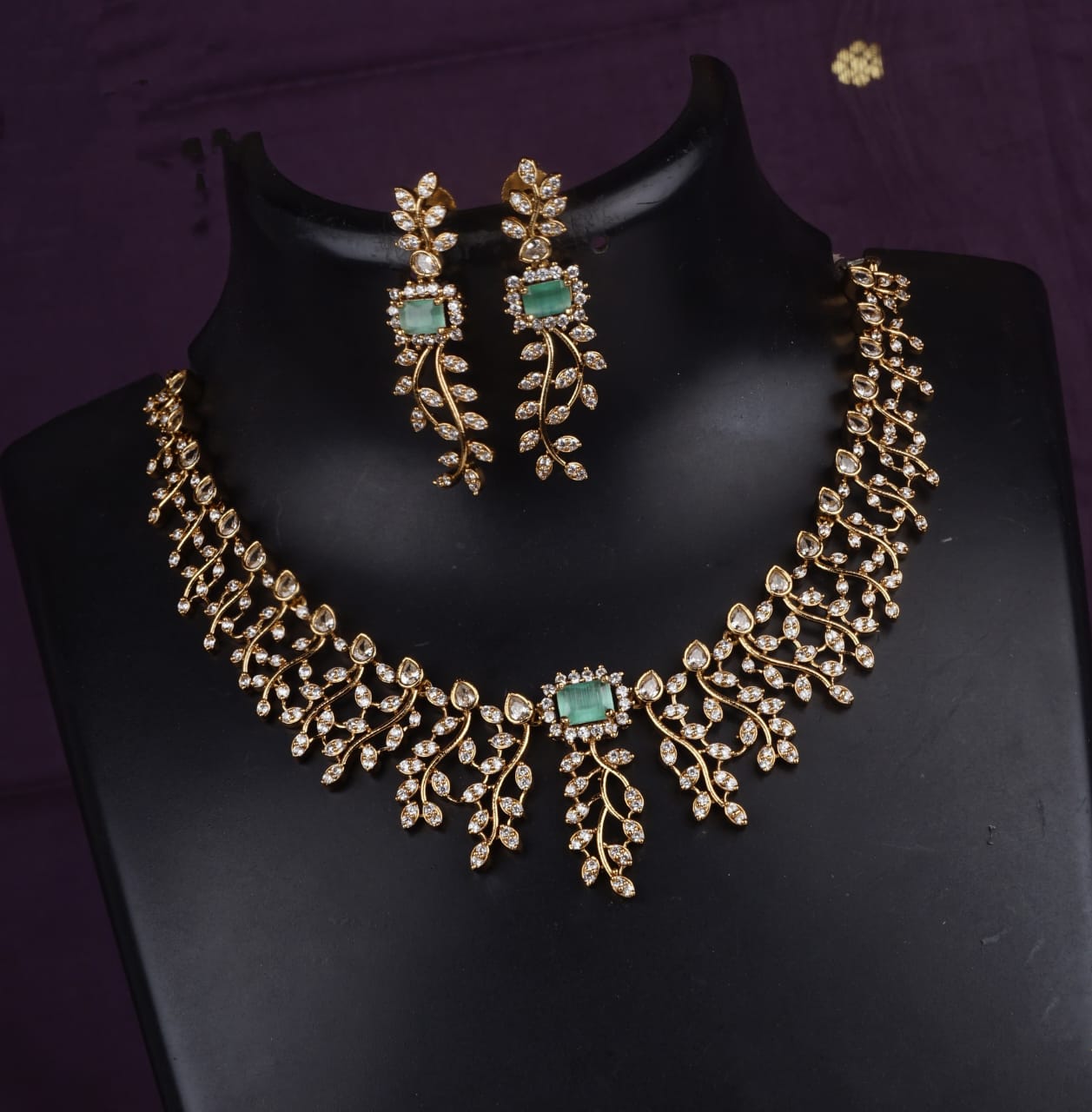 Exquisite Gold and Diamond Necklace with Emerald Accents